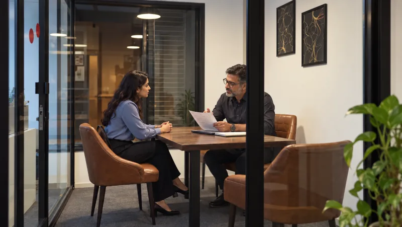 A Salsoft team member and manager discussing career development.