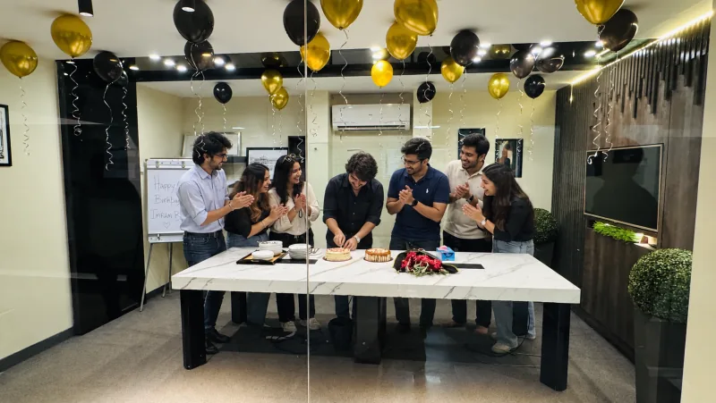 Salsoft team members celebrating a colleague's birthday in the Karachi office.